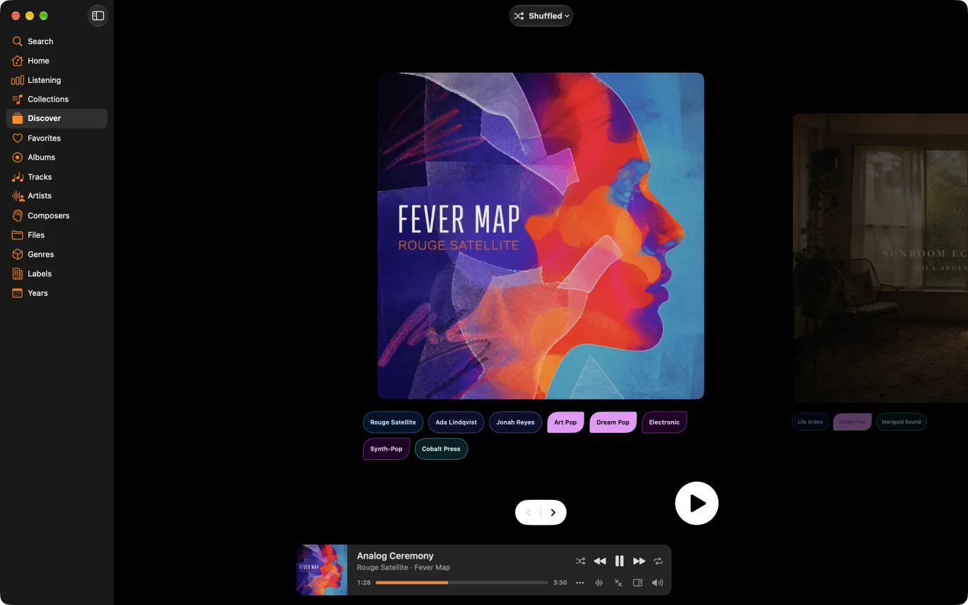Discover showing one album cover at a time, with its tags below